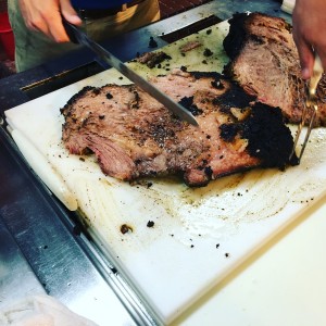 Slicing brisket at Rudy's Country Store and BBQ.